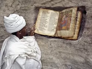 Related Images Collection: A Priest of the Ethiopian Orthodox Church reads a very old