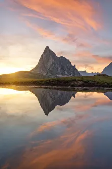 the Ra Gusela mountain reflected in small puddle of water at sunset, Giau Pass, Dolomiti the Ra Gusela mountain reflected in small puddle of water at sunset, Giau Pass, Dolomiti