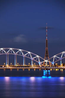 Railway bridge across Daugava River with TV tower in background, Riga, Latvia