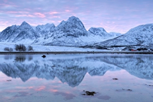 Rakeltinden is reflected in the fjord. Storsteinnes, Balsfjorden, Lyngen Alps, Troms Rakeltinden is reflected in the fjord. Storsteinnes, Balsfjorden, Lyngen Alps, Troms