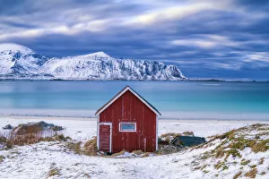 Red Cabin on Ramberg Beach, Lofoten Islands, Norway Red Cabin on Ramberg Beach, Lofoten Islands, Norway