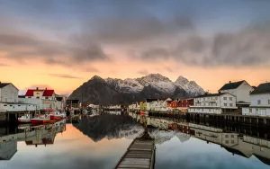 Reflected in the waters, Henningsvaer fjord. Lofoten Islands. Norway. Europe Reflected in the waters, Henningsvaer fjord. Lofoten Islands. Norway. Europe