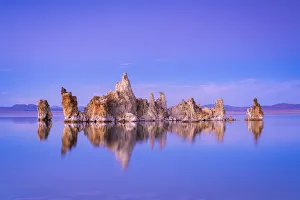 Reflection of rock formation in South Tufa on Mono Lake against blue sky at dusk Reflection of rock formation in South Tufa on Mono Lake against blue sky at dusk