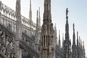 On the rooftop of the Duomo di Milano, among the white marble spiers, Milano, Lombardy On the rooftop of the Duomo di Milano, among the white marble spiers, Milano, Lombardy