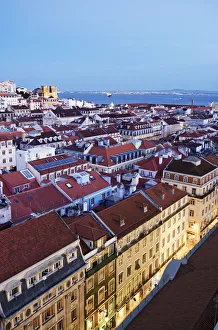 Rooftops of the Baixa, the historic centre of Lisbon, with the Tagus river and the Rooftops of the Baixa, the historic centre of Lisbon, with the Tagus river and the
