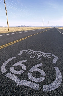 Route 66 Sign on Empty Road / Historic Route 66 Highway Route 66 Sign on Empty Road / Historic Route 66 Highway