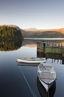 Rowing boats moored on Loch Katrine at Stronachlachar, Stirling, Scotland. Autumn Rowing boats moored on Loch Katrine at Stronachlachar, Stirling, Scotland. Autumn