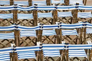 Rows of traditional blue and white deckchairs, Eastbourne, Sussex, UK Rows of traditional blue and white deckchairs, Eastbourne, Sussex, UK