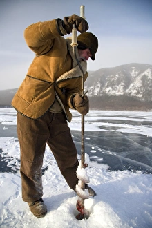 Russia, Siberia, Baikal; Undergoing preparations for fishing on frozen lake baikal in winter Russia, Siberia, Baikal; Undergoing preparations for fishing on frozen lake baikal in winter