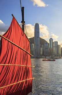 Sail of junk boat and skyline of Hong Kong Island, Hong Kong Sail of junk boat and skyline of Hong Kong Island, Hong Kong
