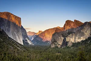 Scenic view of forest in valley amidst rocky mountains at Tunnel View Scenic view of forest in valley amidst rocky mountains at Tunnel View