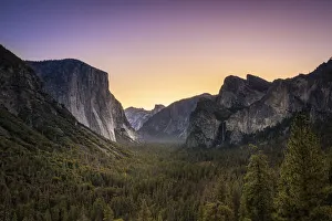 Scenic view of trees by rocky mountains at Tunnel View before sunrise Scenic view of trees by rocky mountains at Tunnel View before sunrise