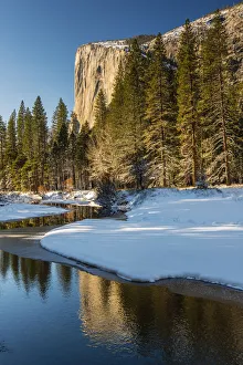 Scenic winter landscape with El Capitan mountain reflected in the river, Yosemite Scenic winter landscape with El Capitan mountain reflected in the river, Yosemite