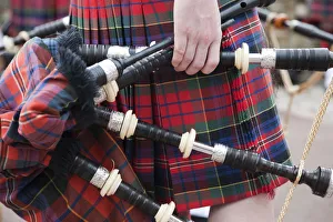 Scotland, Edinburgh, The Royal Mile, Hand Holding Bagpipes Scotland, Edinburgh, The Royal Mile, Hand Holding Bagpipes