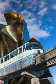 Seattle Center Monorail passing through the Experience Music Project and Science Fiction Seattle Center Monorail passing through the Experience Music Project and Science Fiction