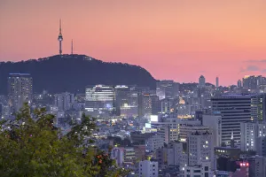 Seoul Tower and cityscape at sunset, Seoul, South Korea Seoul Tower and cityscape at sunset, Seoul, South Korea