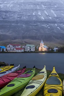 Seydisfjordur, eastern fjords, Iceland. Church and moored kayaks Seydisfjordur, eastern fjords, Iceland. Church and moored kayaks