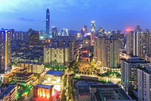 Shenzhen skyline at twilight with the tallest building of the city on background Shenzhen skyline at twilight with the tallest building of the city on background