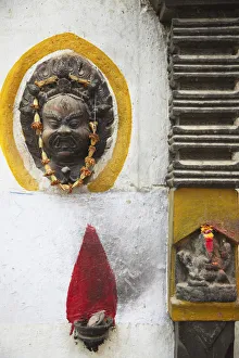 Shrine and mask outside house, Kathmandu, Nepal Shrine and mask outside house, Kathmandu, Nepal