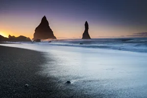 Sudurland Region Gallery: Silhouette Reynisdrangar rock formations in sea near Vik i Mydral during sunrise