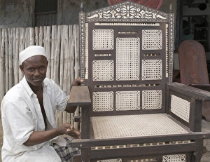 A skilled craftsman puts the finishes touches to a A skilled craftsman puts the finishes touches to a