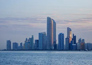 Skyline of the city center at sunrise, Abu Dhabi, United Arab Emirates Skyline of the city center at sunrise, Abu Dhabi, United Arab Emirates