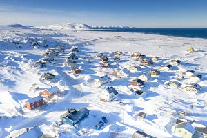 Snow covering the fishing village of Berlevag by the arctic sea, aerial view Snow covering the fishing village of Berlevag by the arctic sea, aerial view