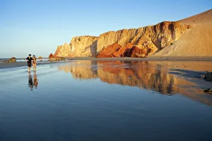 South America, Brazil, Ceara, Morro Branco, a couple walk along a long sandy beach South America, Brazil, Ceara, Morro Branco, a couple walk along a long sandy beach
