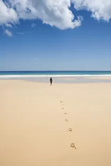 Images Dated 19th March 2013: South America, Brazil, Pernambuco, Fernando de Noronha Island, a girl walking along