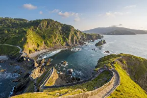 Spain, Basque Country, Gaztelugatxe. Walkway to the hermitage at sunset Spain, Basque Country, Gaztelugatxe. Walkway to the hermitage at sunset