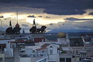 Spain, Madrid, elevated view of figures atop BBVA building, from the Circulo de Bellas Spain, Madrid, elevated view of figures atop BBVA building, from the Circulo de Bellas