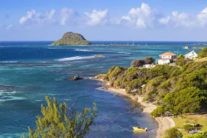 St Vincent and The Grenadines, View of beach on Union Island, with Frigate Island St Vincent and The Grenadines, View of beach on Union Island, with Frigate Island