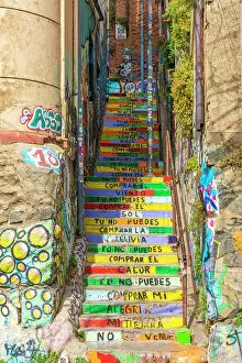 Narrow Collection: Staircase at Pasaje Galvez painted with colors and lyrics of song named Latinoamerica by Puerto
