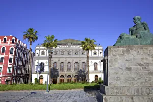 Statue of Canarian Novelist Benito Perez Galdos with Perez Galdos Theatre in the Statue of Canarian Novelist Benito Perez Galdos with Perez Galdos Theatre in the