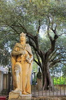 Statue of King Alfonso X at the entrance of Alcazar of the Christian Kings (Alcazar Statue of King Alfonso X at the entrance of Alcazar of the Christian Kings (Alcazar