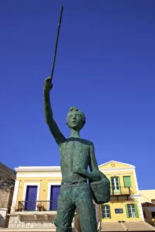 Statue Of Little Michael The Fisher Boy On Symi Waterfront, Symi, Dodecanese, Greek Statue Of Little Michael The Fisher Boy On Symi Waterfront, Symi, Dodecanese, Greek