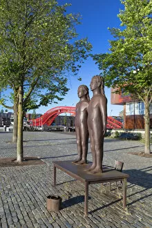 Statue in park and Python Bridge, Zeeburg, Amsterdam, Noord Holland, Netherlands
