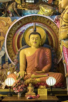 Statue of sitting Buddha a Gangaramaya temple in Colombo, Sri Lanka Statue of sitting Buddha a Gangaramaya temple in Colombo, Sri Lanka