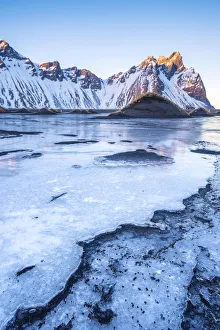 Stokksnes, Eastern Iceland, Europe. Vestrahorn mountain in a frozen winter landscape Stokksnes, Eastern Iceland, Europe. Vestrahorn mountain in a frozen winter landscape