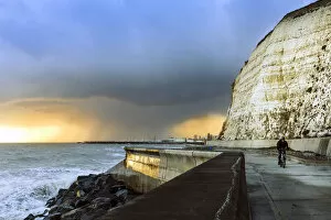 Brighton & Hove Collection: Storm clouds over the English Channel near Brighton with the white cliffs of Peacehaven