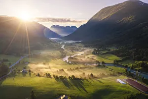Stryn, Sogn og Fjordane, Norway. Winding river in the fog at sunrise Stryn, Sogn og Fjordane, Norway. Winding river in the fog at sunrise