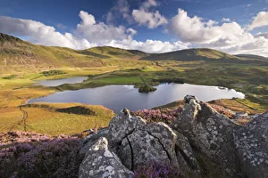 Sunlit mountains surrounding Cregennen Lakes, Snowdonia National Park, Wales, UK Sunlit mountains surrounding Cregennen Lakes, Snowdonia National Park, Wales, UK