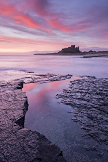 Sunrise over Bamburgh Castle on the Northumberland coast, England. Spring (March) 2015 Sunrise over Bamburgh Castle on the Northumberland coast, England. Spring (March) 2015
