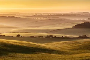 Sunrise over farmland in the Piddle Valley towards Piddlehinton, Dorset, England, UK Sunrise over farmland in the Piddle Valley towards Piddlehinton, Dorset, England, UK
