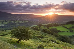 Sunrise over the Sugarloaf and town of Crickhowell, Brecon Beacons National Park, Powys Sunrise over the Sugarloaf and town of Crickhowell, Brecon Beacons National Park, Powys