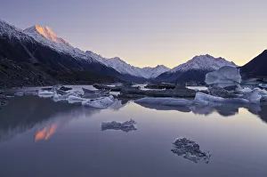 Sunrise at Tasman Lake, Mount Cook National Park, Canterbury, New Zealand Sunrise at Tasman Lake, Mount Cook National Park, Canterbury, New Zealand