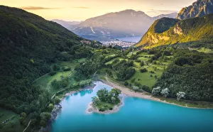 Sunrise in Tenno Lake with Riva del Garda and Baldo mountain on the background Sunrise in Tenno Lake with Riva del Garda and Baldo mountain on the background