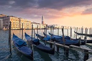 Sunset with gondolas and St. Mark belltower. Venice, Veneto, Italy Sunset with gondolas and St. Mark belltower. Venice, Veneto, Italy