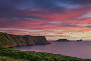 Sunset over Rhossili Bay & Worm's Head, Gower Peninsula,West Glamorgan, Wales Sunset over Rhossili Bay & Worm's Head, Gower Peninsula,West Glamorgan, Wales