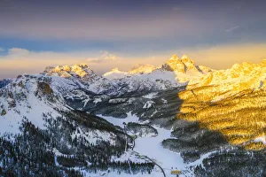 Sunset over Tre Cime di Lavaredo and Monte Piana covered with snow, aerial view, Misurina Sunset over Tre Cime di Lavaredo and Monte Piana covered with snow, aerial view, Misurina